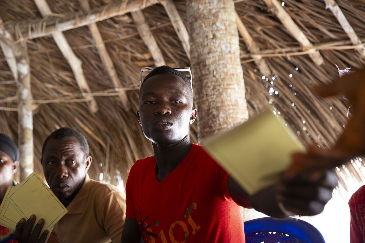 Scenes from a VSLA meeting in Sierra Leone. (Photos: Kieran McConville/Concern Worldwide)