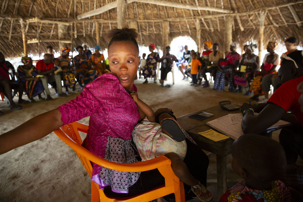 Secretary Assanatu Konteh at a VSLA meeting at Magborkorr in Sierra Leone. (Photo: Kieran McConville / Concern Worldwide)