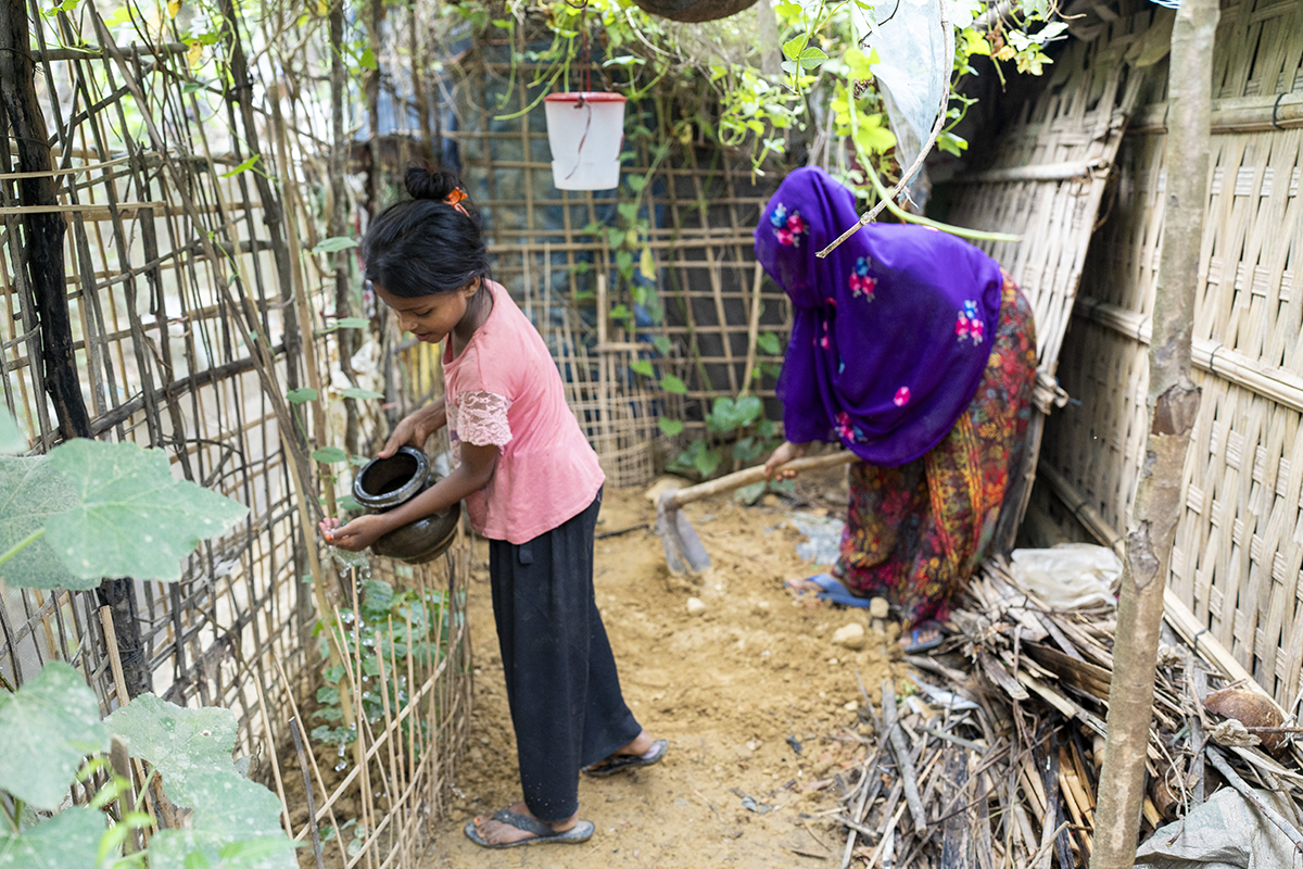 Kulsum* with her daughter in their home garden at Camp 13. (Photo: Saikat Mojumder/Concern Worldwide)