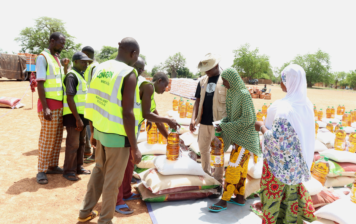 Concern staff distribute food kits to families in Koupéla, Burkina Faso. The country's location in the Sahel means it's used to year-round heat, but it faced an extreme and deadly heat wave earlier this year. (Photo: Concern Worldwide)