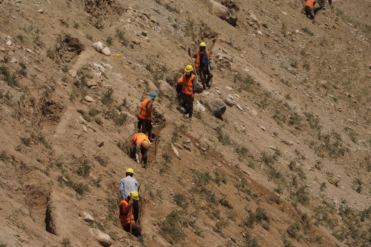 Community members in flood-prone areas in Afghanistan's Badakhshan province, have started to construct watersheds and canals as part of the inclusive livelihood project Faragir. The watershed irrigates the surrounding dry areas through a newly created water supply and protects villages against potential floods. (Photo: Marissa Droste/Concern Worldwide)