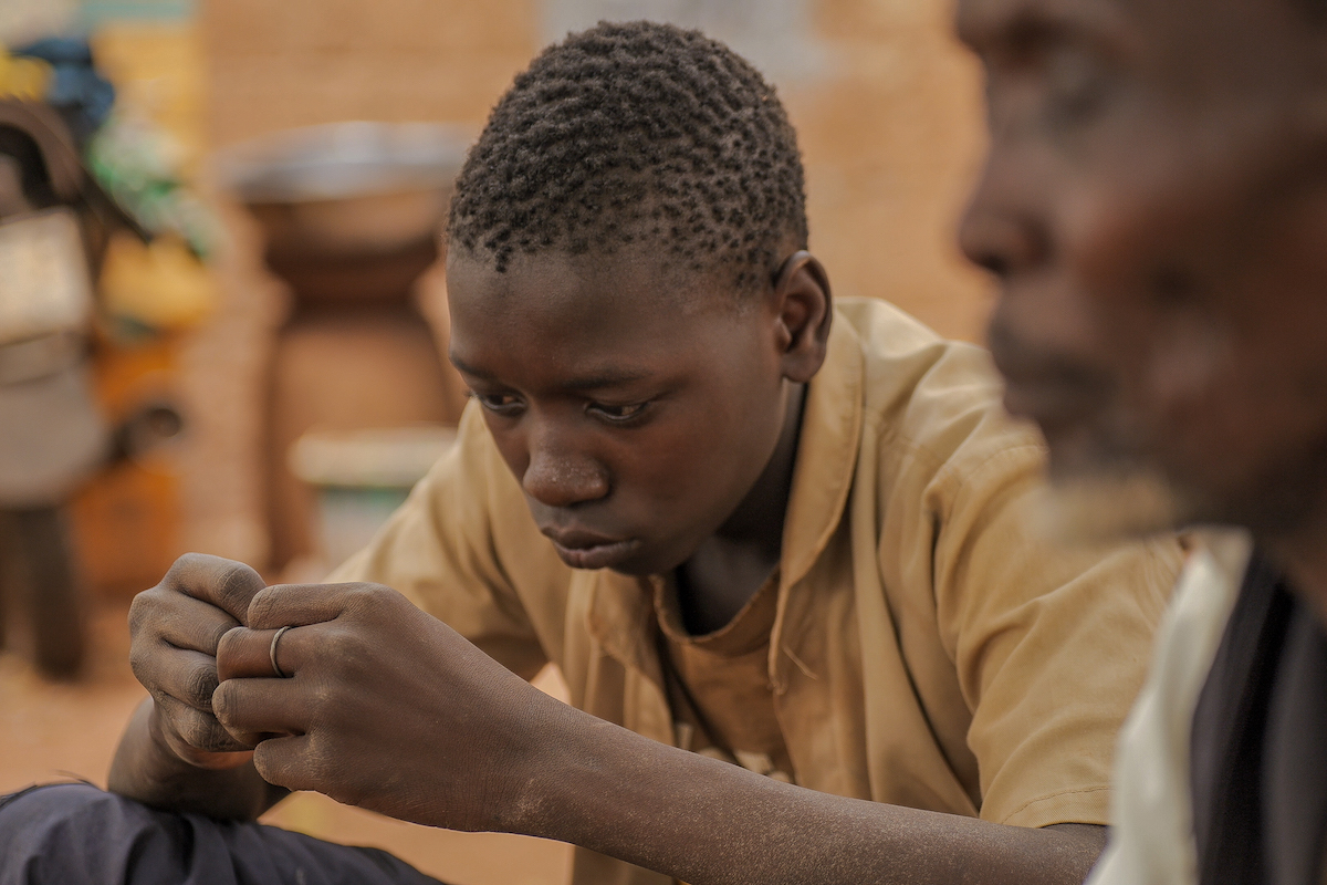 Aly (15) had to wait three years before he could confront the traumatic events he witnessed, which forced him and his family to flee their locality. They found themselves in a camp of 70,000 displaced people on the outskirts of Ouahigouya, in the north-west of Burkina Faso. (Photo: ICRC/Concern Worldwide)