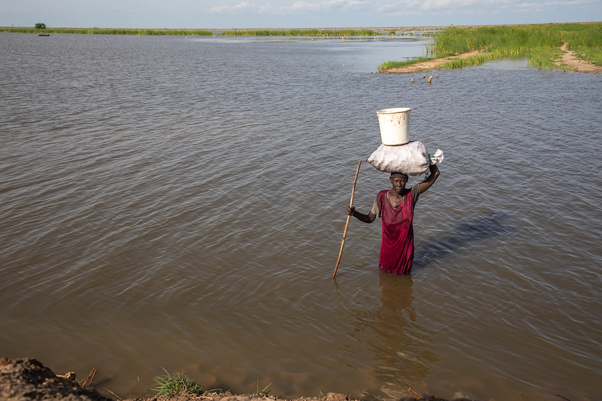 Nyakeok Top Leny (56) returns from harvesting water lilies in the flooded waters of Bentiu, South Sudan. (Photo: Eugene Ikua/Concern Worldwide)