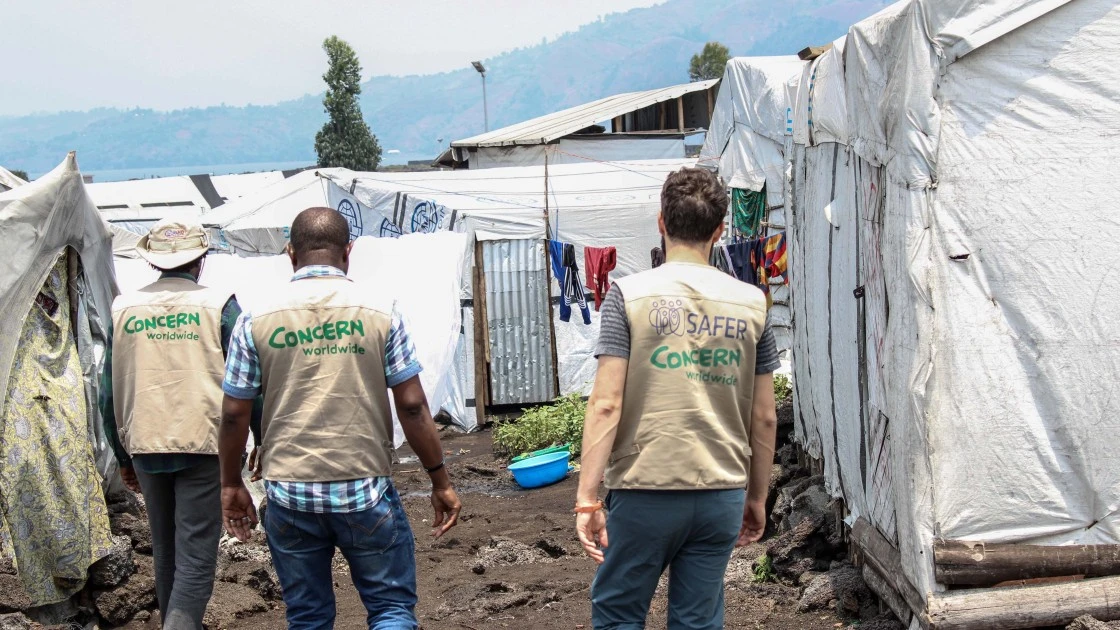 Concern DRC staff visit a displacement site in Goma, North Kivu, where Concern provides drinking water to over 230,000 people each day. Photo: Samuel Isenge/Concern Worldwide