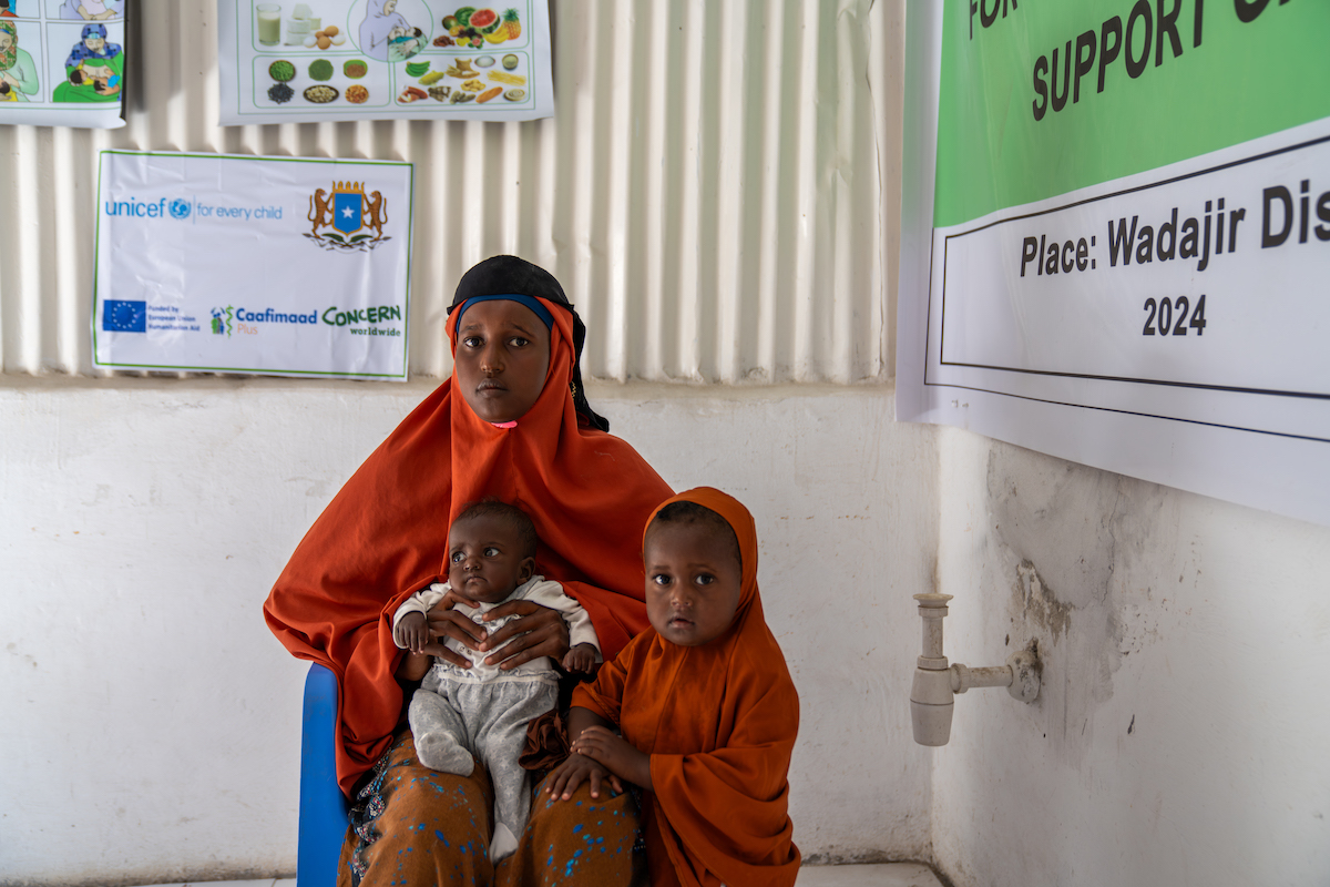 Naima* with six-month-old Leyla* on her lap and two-and-a-half-year-old Jamilah in the Concern-supported Wajadir clinic. (Photo: Eugene Ikua/Concern Worldwide)