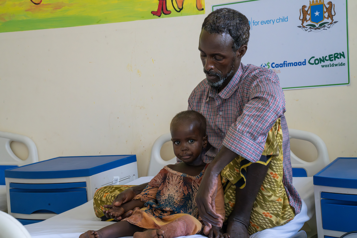 Raheem* with three-year-old Faduma* at Banadir Hospital's Stabilization Center, where Faduma was treated for acute malnutrition. (Photo: Eugene Ikua/Concern Worldwide)