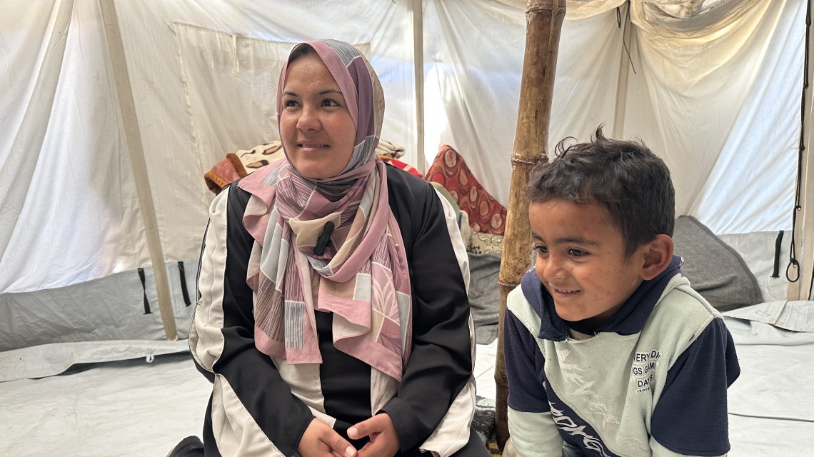 Dalia is living with her child, husband and mother-in-law in a tent in Deir Al-Balah. Photo: Khalil Adwan. Displaced Palestinians start to return their houses past damaged buildings Displaced Palestinians start to return their houses past damaged buildings, after the announcement of ceasefire. Photo: Anadolu/Getty Images Siham with his children Siham is a father of seven children and is displaced from Tel Al-Tuffah. (Photo: Khalil Adwan)