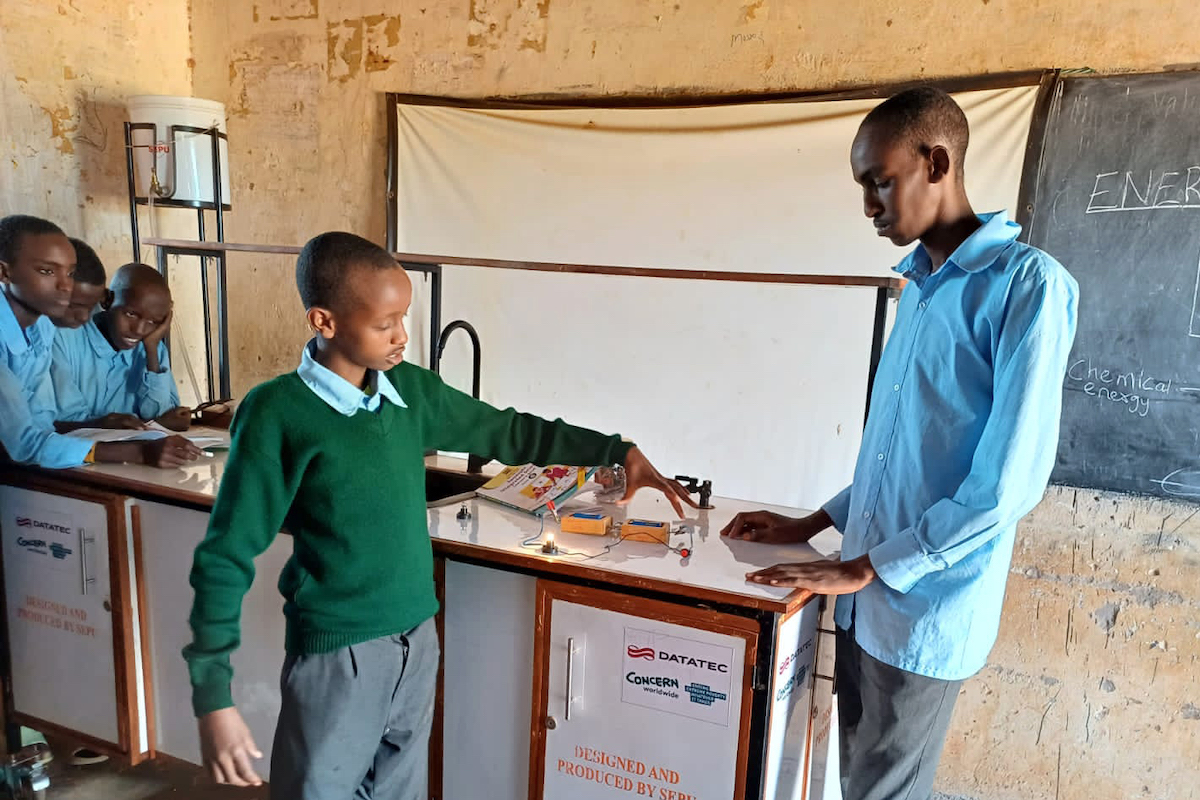 Grade 8 boys from Turbi Junior School take part in a hands-on practical session during their integrated science class. (Photo: Concern Worldwide)