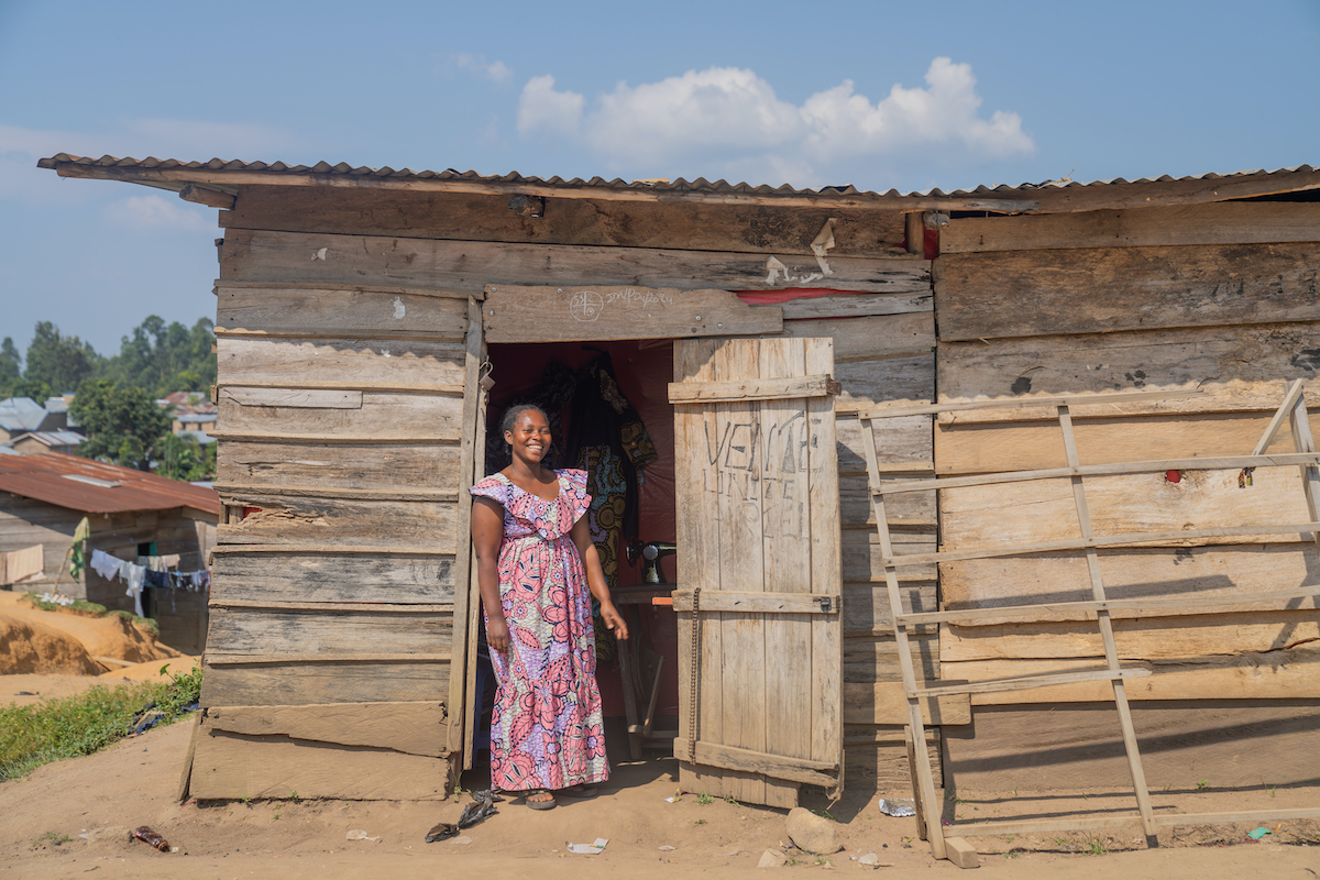 Alice at the shop she was able to start in part through her participation in a Concern-led VSLA. With a loan from her VSLA, she began to sell fabric, and she's also teaching others to sew so they can start their own shops. (Photos: Eugene Ikua/Concern Worldwide)
