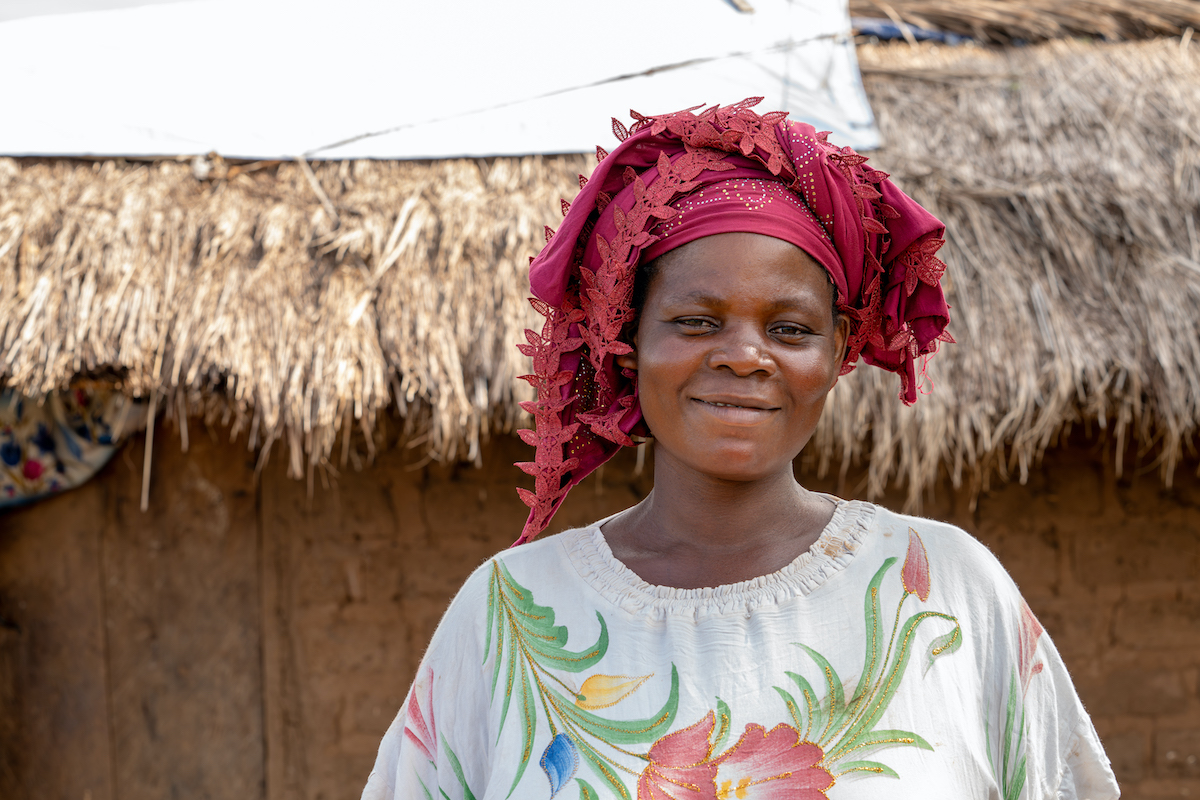 Maria Kasongo Mwabana outside her home in Kabutonga. She has been able to recover what was lost due to local conflict thanks in part to her local VSLA. (Photo: Eugene Ikua/Concern Worldwide)