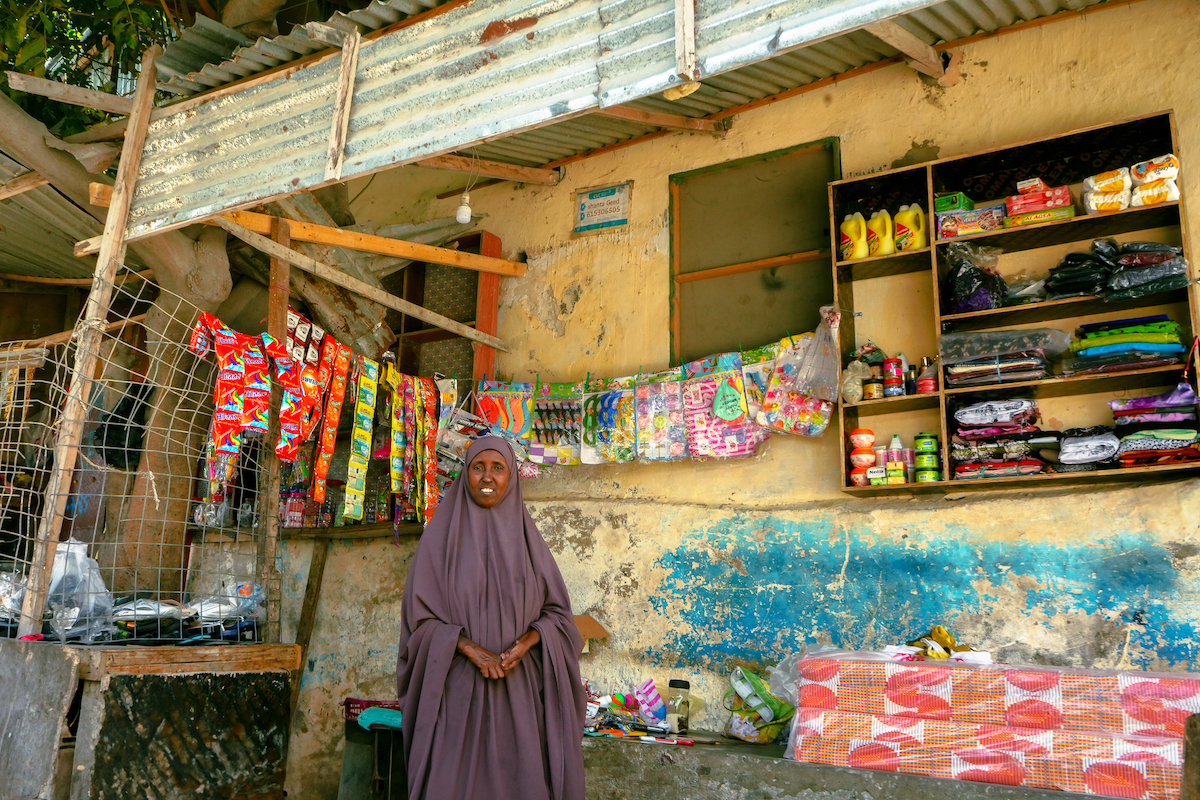 Mako Saney outside of her shop in Mogadishu. She was able to set up a thriving business after participating in a Concern-led Self-Help Group and livelihoods trainings. (Photo: Adnan Mohamed/Concern Worldwide)