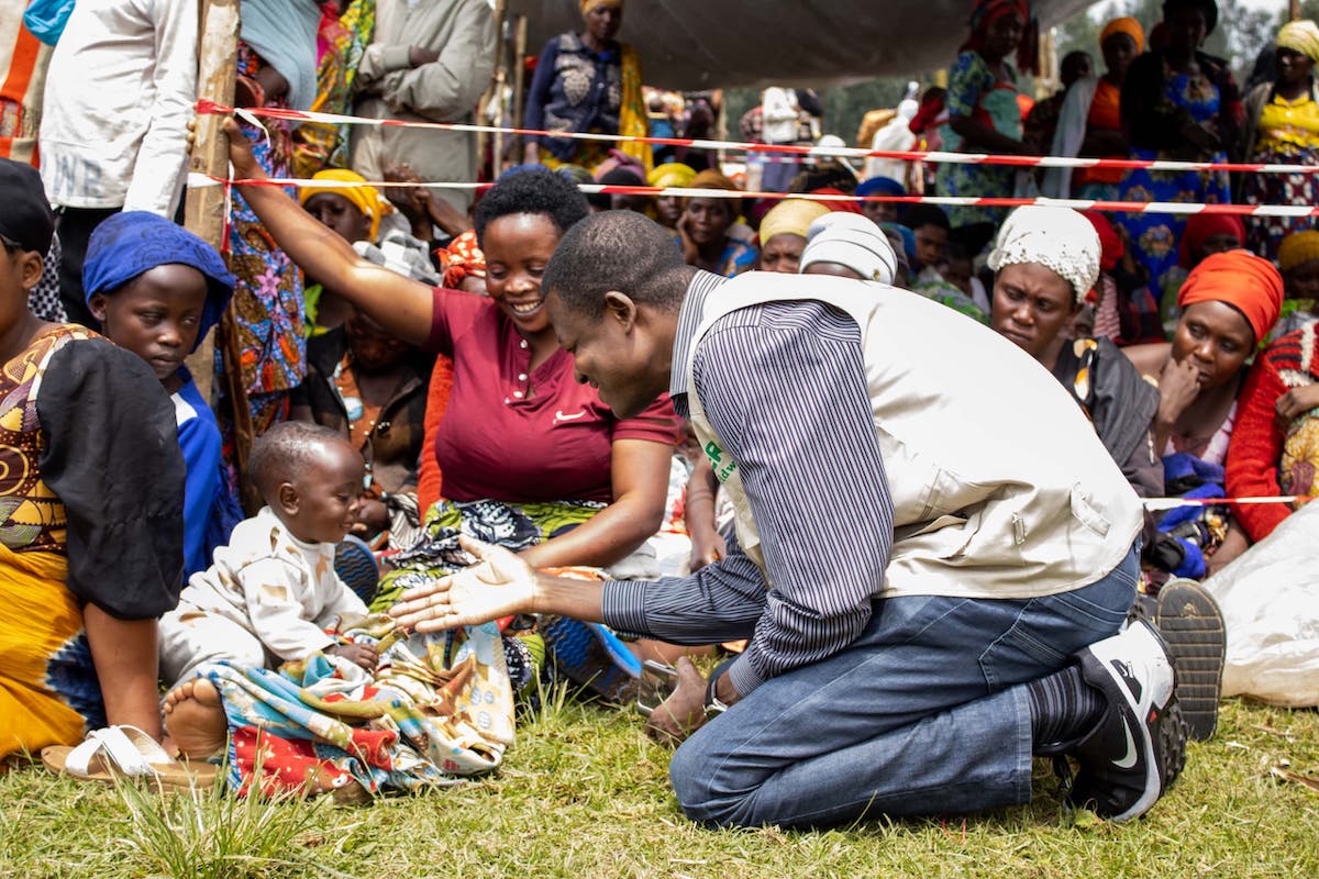 Concern DRC Program Director Mougabe Koslengar assists with a series of distributions of household, hygiene kits, and food support to thousands of people displaced by the conflict in eastern DRC. (Photo: Concern Worldwide)