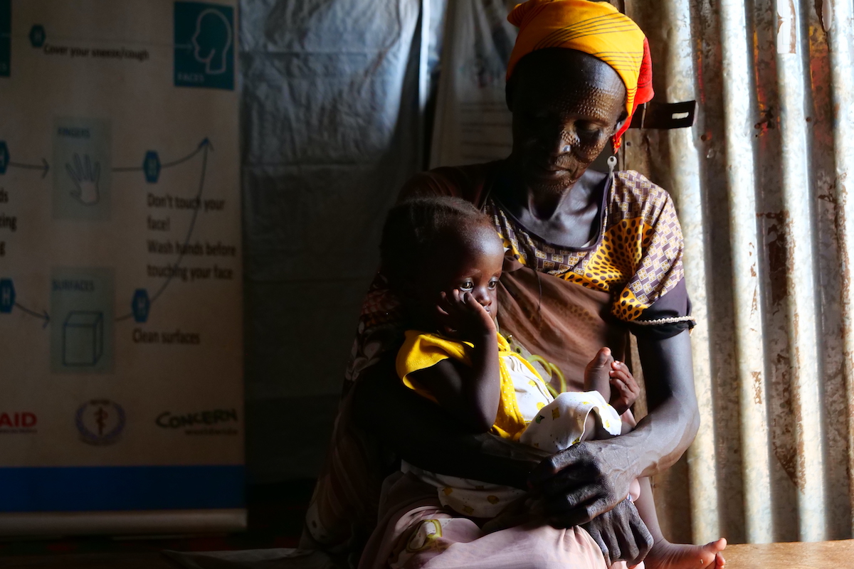 Nyacanya Chatiem with her grandchild Liakuoth at a Concern-supported clinic in Unity State, South Sudan. (Photo: Eugene Ikua/Concern Worldwide)