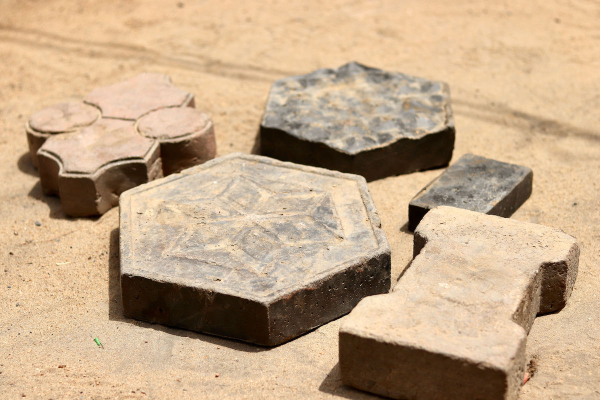 Concern worked with a local Chadian company, Karö Enterprise, to collect over 59kg of packaging (approx. 12,800 empty packages) to recycle into 600 bricks and paving stones for use in construction. (Photos: Pierre Maget/Concern Worldwide)