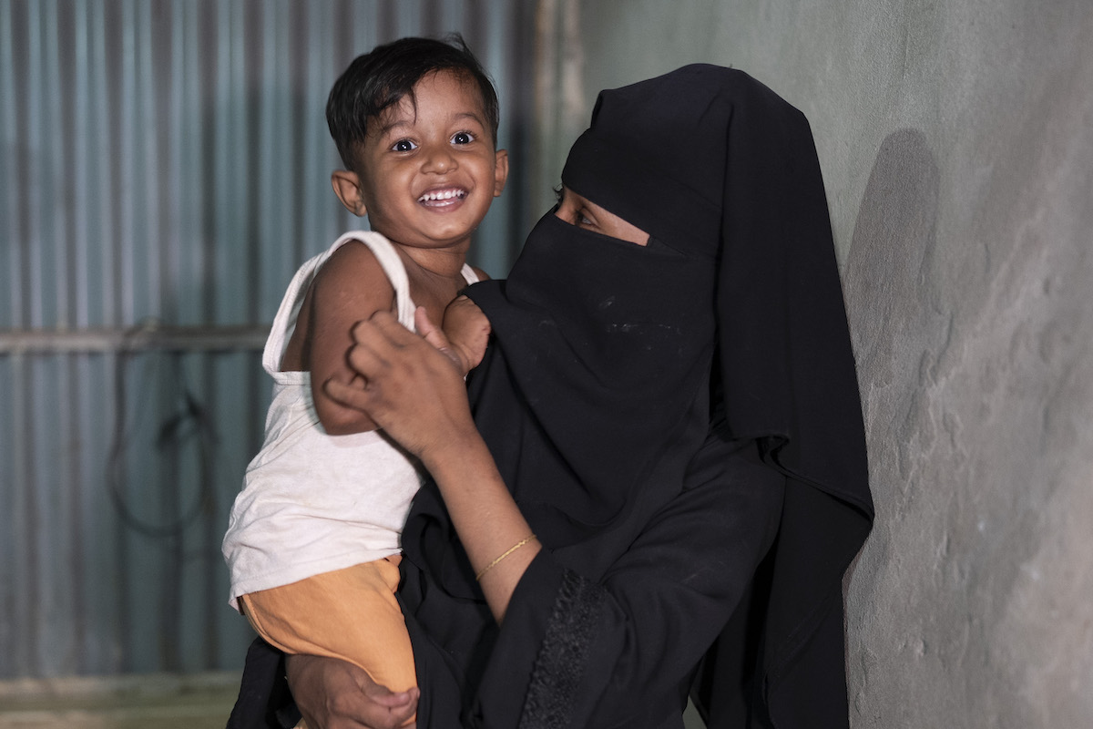 Melina* with her son, Nur*. “Every time we visit the Nutrition Centre, we receive full support. They provide everything we need to meet our nutritional requirements. It feels really good to go there.” (Photo: Saikat Mojumder/Concern Worldwide)