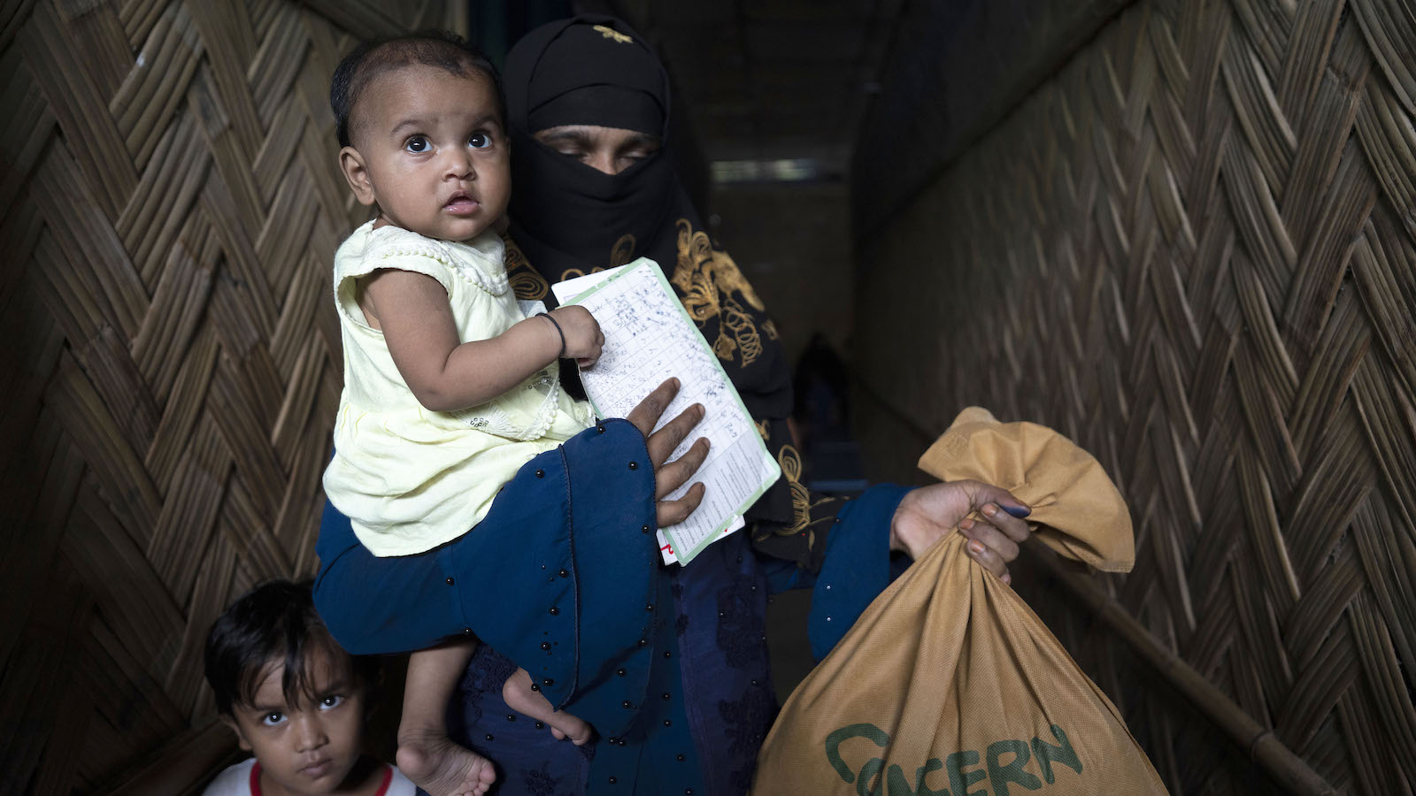Dina* with her one-year-old child Barsha*, just received Super Cereal Plus, a fortified blend of wheat and soya, rich in protein and nutrients provided to pregnant and breastfeeding mothers at the Rohingya camp through the Integrated Nutrition Facilities (INFs) in the camps.