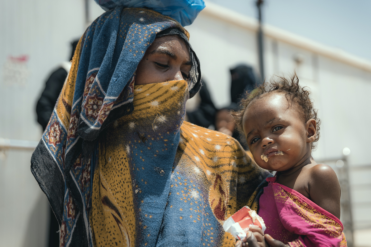 Mother Jemila* and baby Nisa* receive therapeutic food from the Concern supported health clinic in one of the displacement camps in Tuban district where Concern provides health and nutrition services. Photo: Concern Worldwide