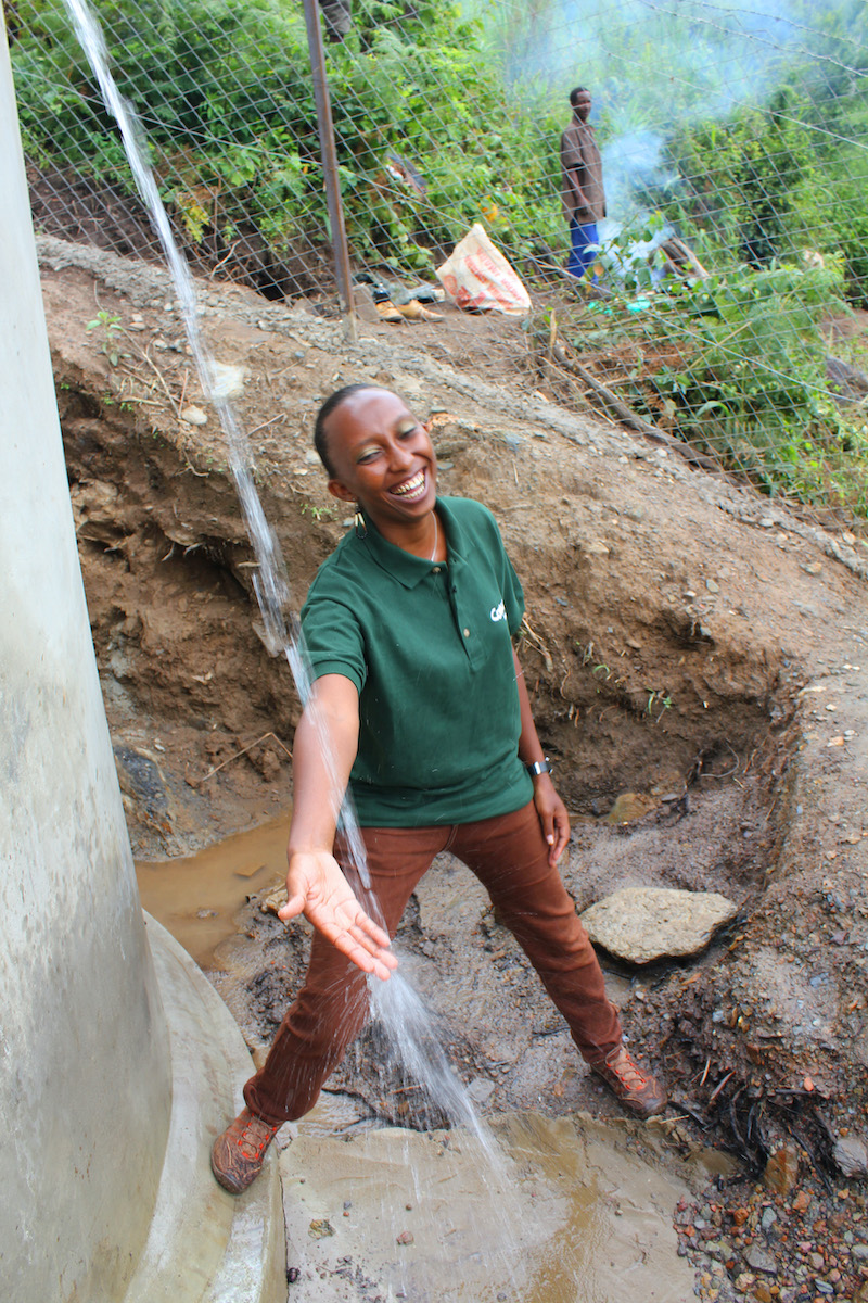 Gloria Kafuria, Concern Worldwide water and sanitation engineer, at a solar water system that she designed. Photo: Crystal Wells/Concern Worldwide