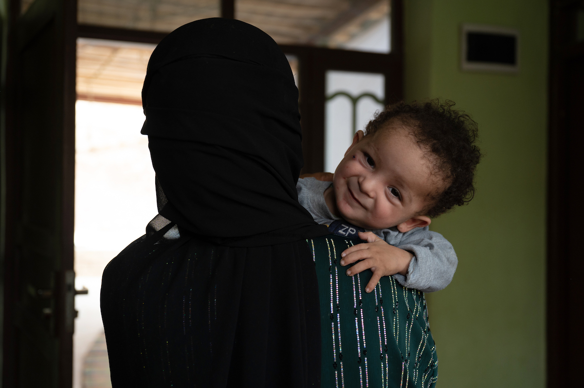 Malalai* holds baby Hafez* at a Family Health House near her home in Takhar Province. Hafez faced multiple health problems after he was born, and his parents have found answers and treatment at this Concern-supported clinic. Photo: Nava Jamshidi/Concern Worldwide