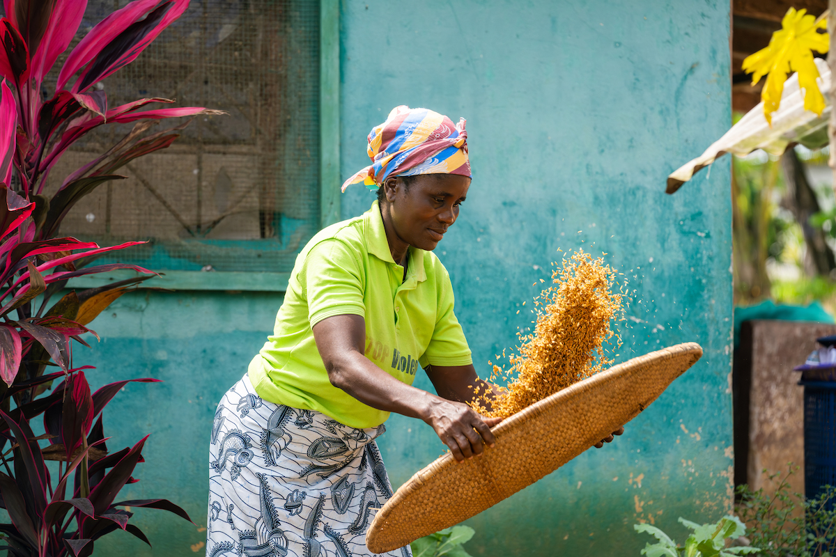 Cathrin Kubagh, at her home in Buchanan City. Through Concern's I-FaNSI program, Cathrin joined a local Community Savings and Loans Association and grows a range of crops including rice and vegetables, supporting her family and sending her children to school.