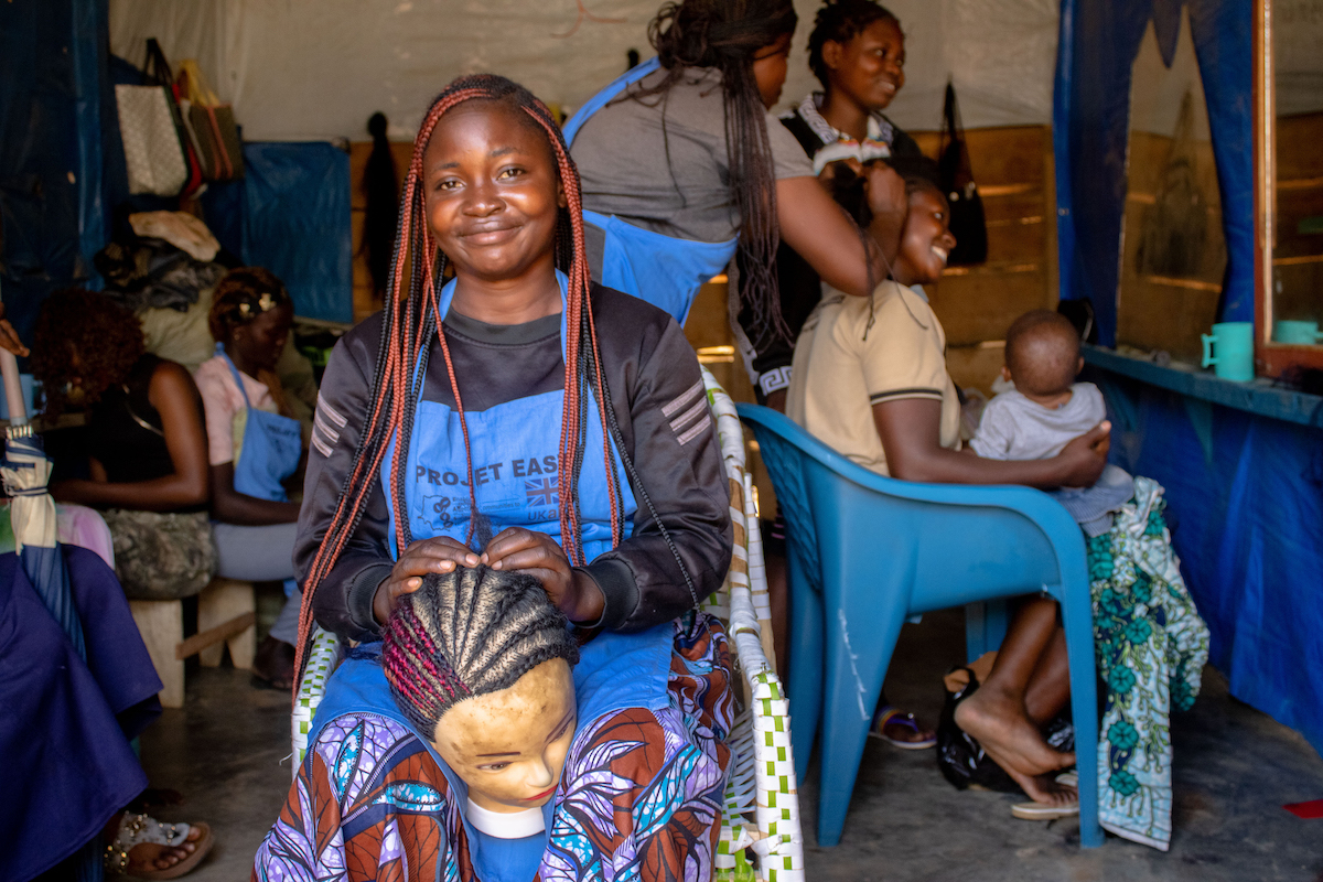 Michèle* attends a women’s hairdressing vocational training under the EAST Program in North Kivu. 