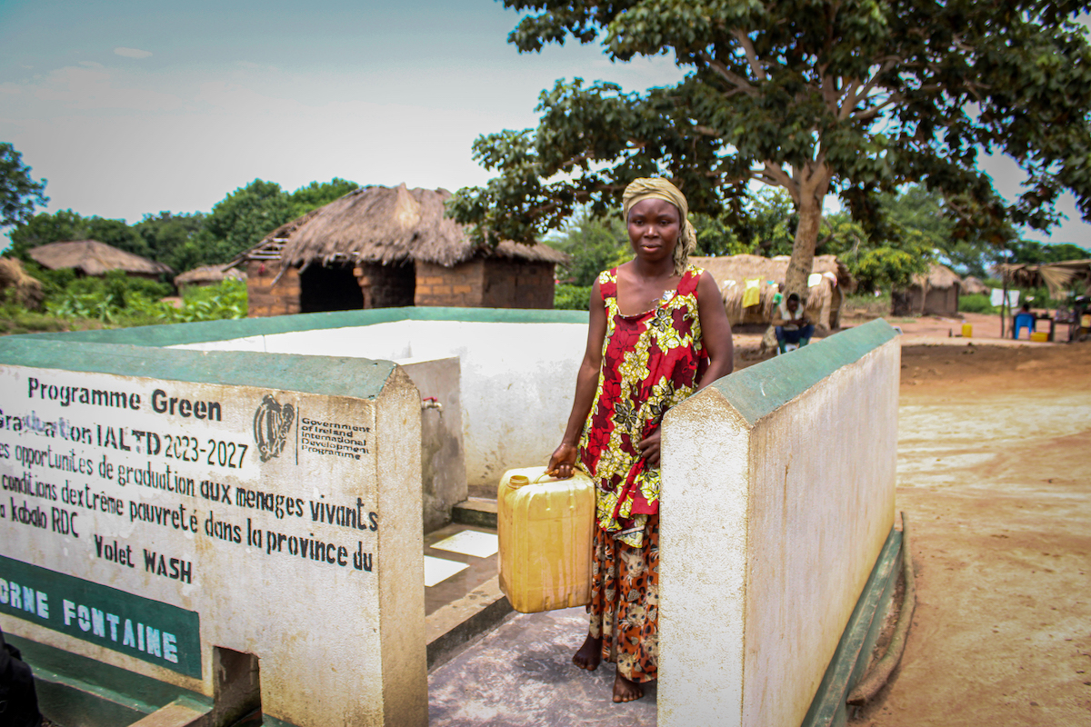 Dada collects water from the standpipe installed by Concern in her village of Kibula, DRC. Photo: Concern Worldwide