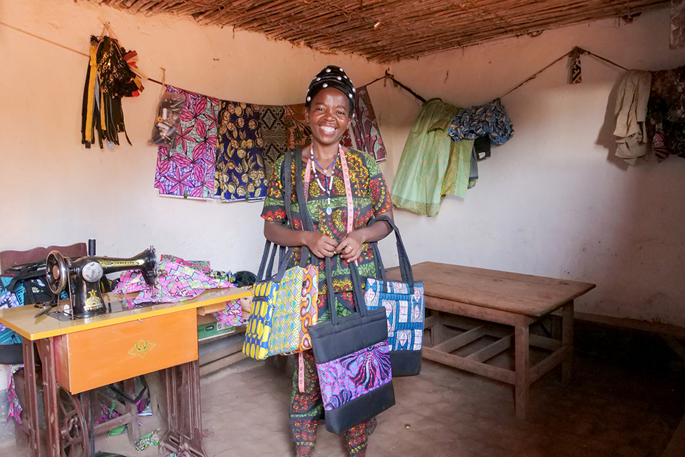 A Rwandan woman with handcrafts