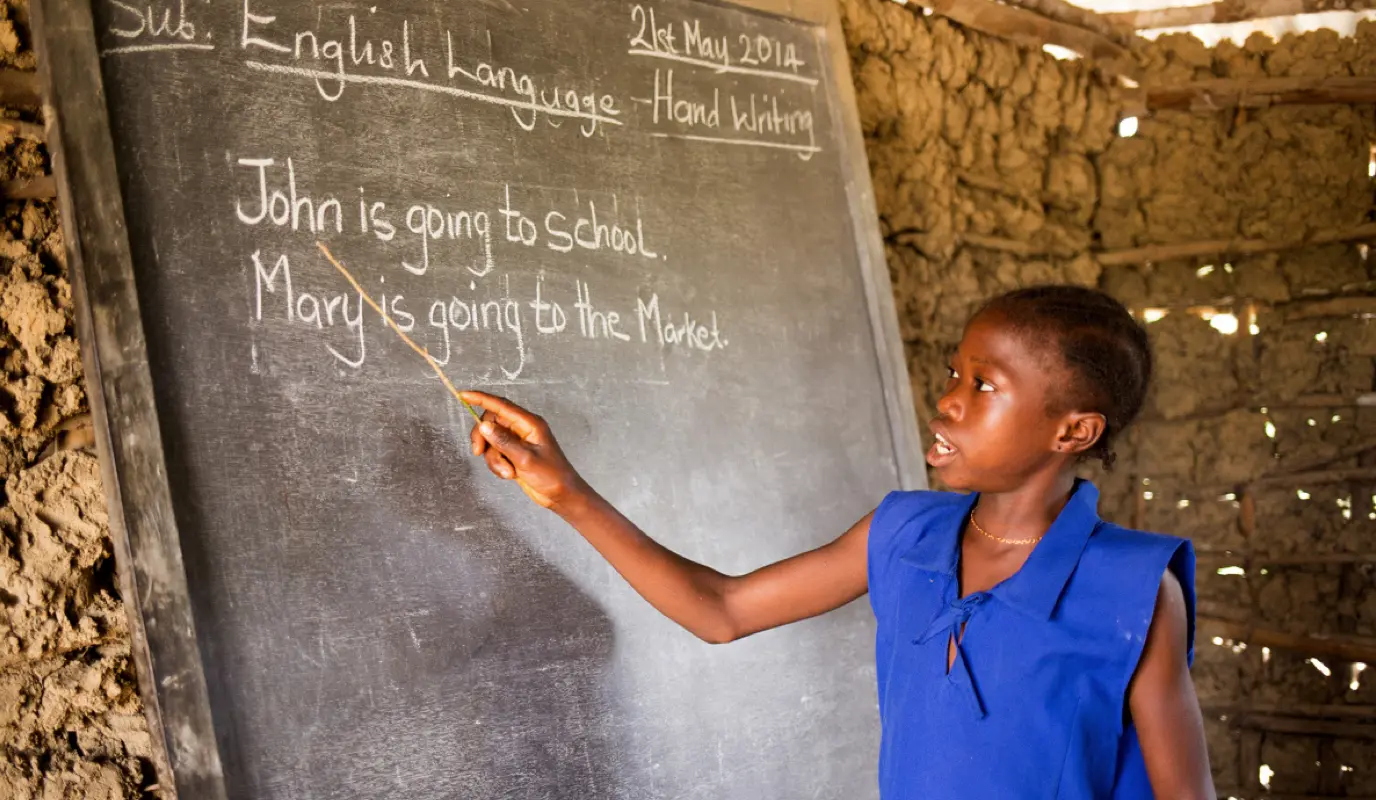 A student practices her English at SLMB Massaba Primary School, Kunike Barina Chiefdom, Sierra Leone. The school participated in Concern's Safe Learning Model, a five-year program designed to address and reduce school-related gender-based violence (SRGBV)
