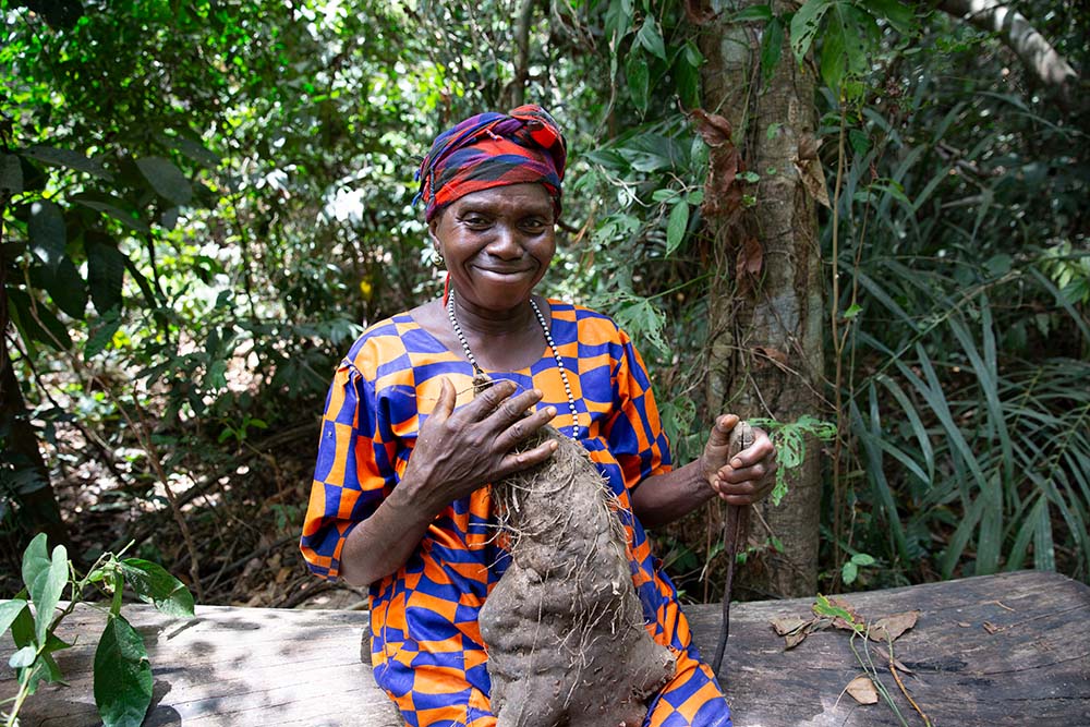 A woman in Sierra Leone with a bush yam