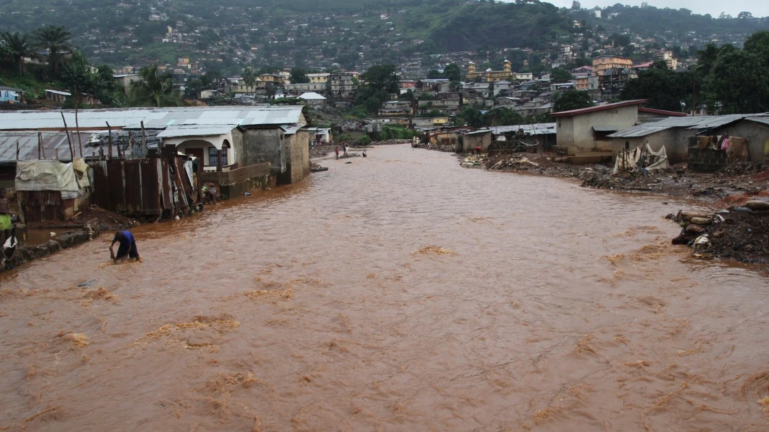 Aftermath of the 2017 mudslides in Freetown, Sierra Leone. (Photo: Kristen Myers/Concern Worldwide)Amani from the Buhene district in the north of Goma, collects the rubble after a volcanic eruption. (Photo Esdras Tsongo/Concern Worldwide)