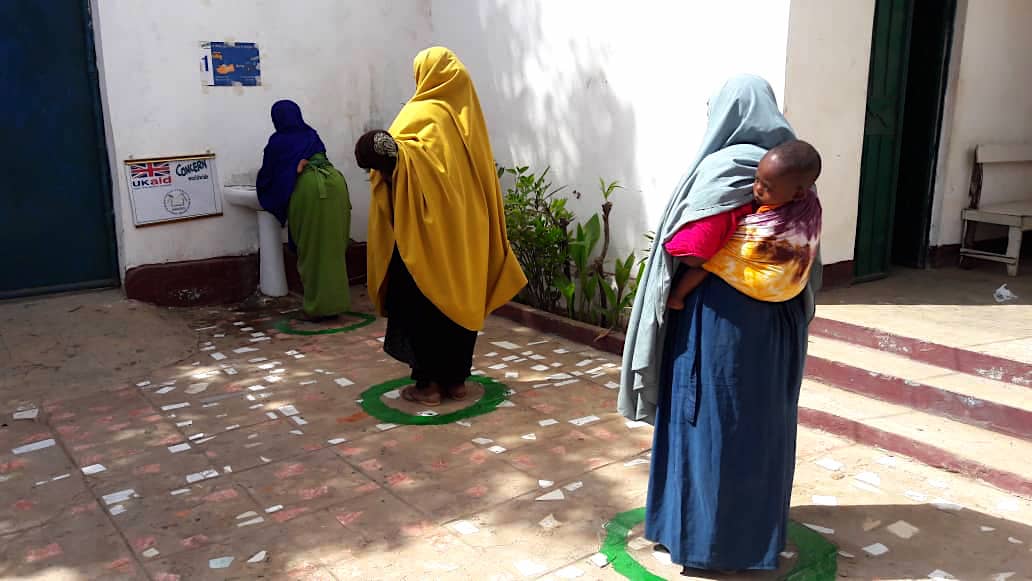 In light of COVID-19, health facilities have implemented new measures to separate people while seeking services such as controlled patient pathways from one area to the next. A key feature has been to include ample hand washing stations. SHACDO has been raising awareness about the importance of proper hand and cough hygiene in combination with demonstration hand washing classes for both staff and patients. (Photo: Concern Worldwide)