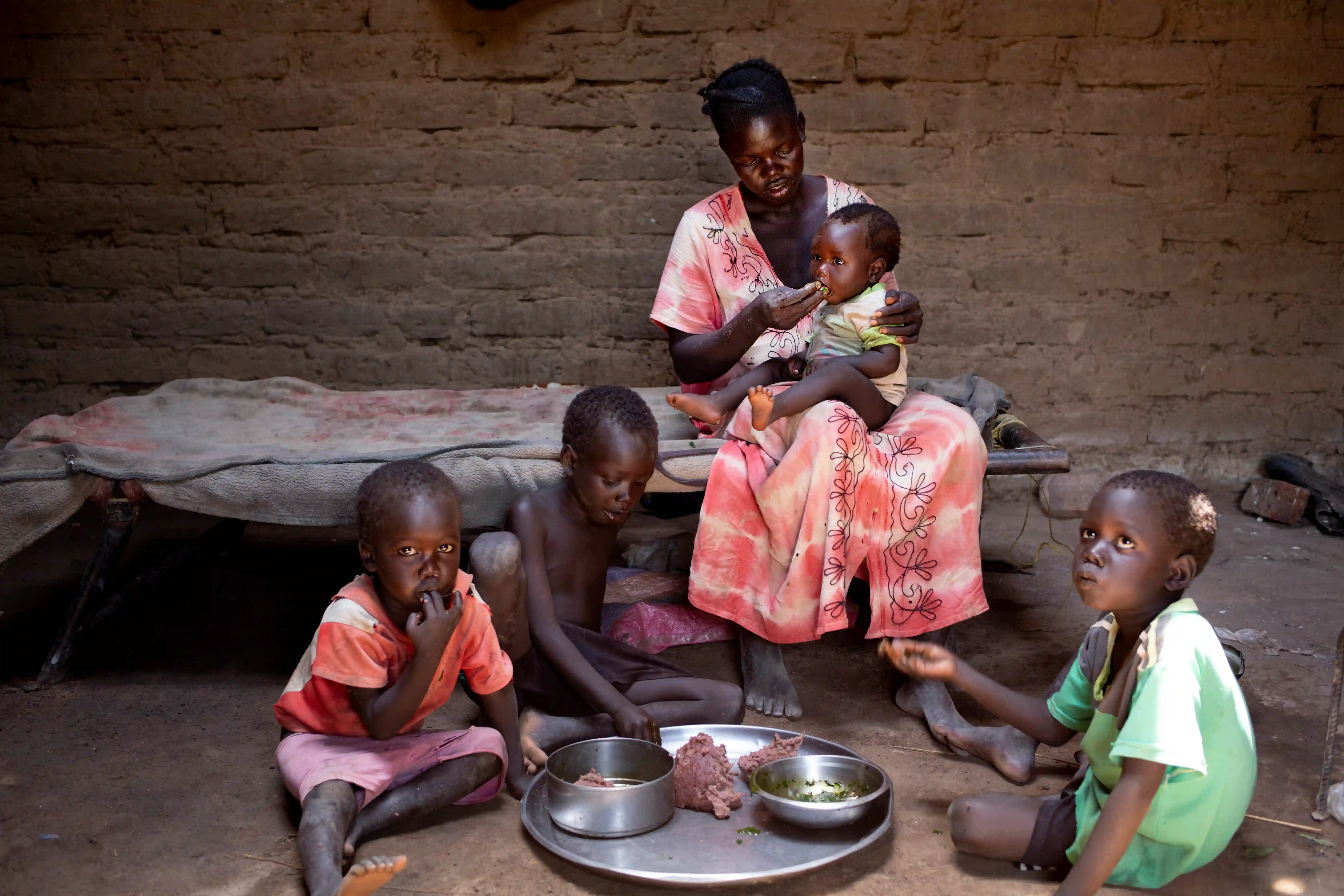 A family eats dinner in South Sudan