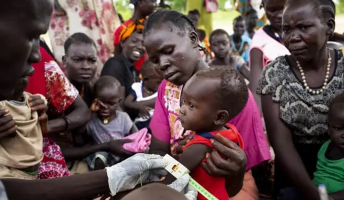 Concern staff screen children for malnutrition in South Sudan.