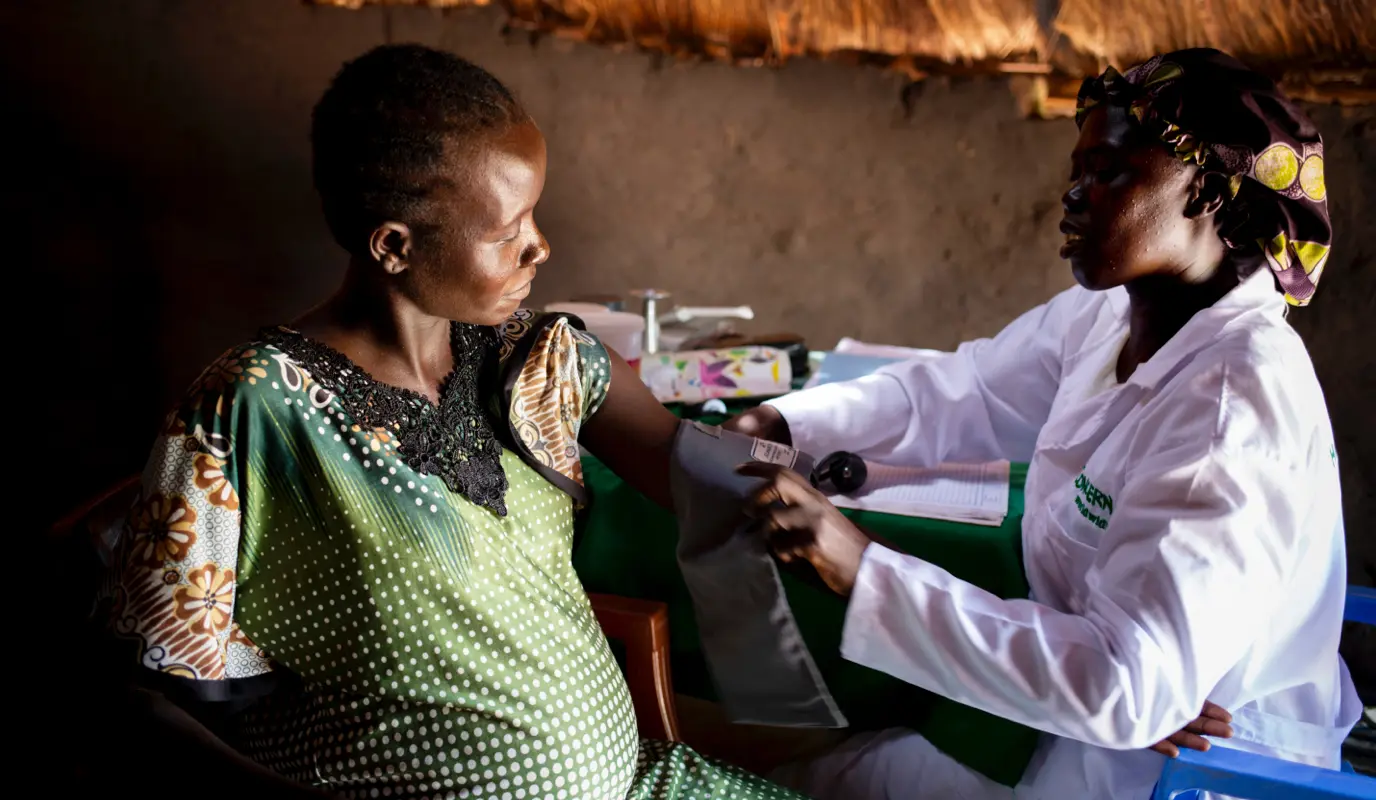 Pregnant woman is seen by Concern midwife Rebekka at a Mobile Health Clinic in a remote rural area of Aweil, South Sudan.