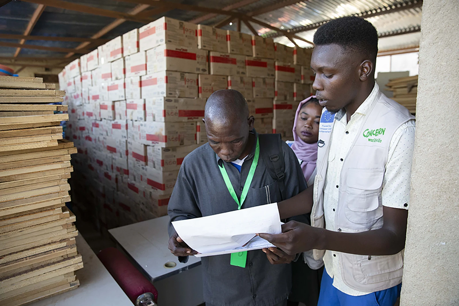 Collecting ready-to-use therapeutic food supplies at the Concern warehouse in El Geneina.