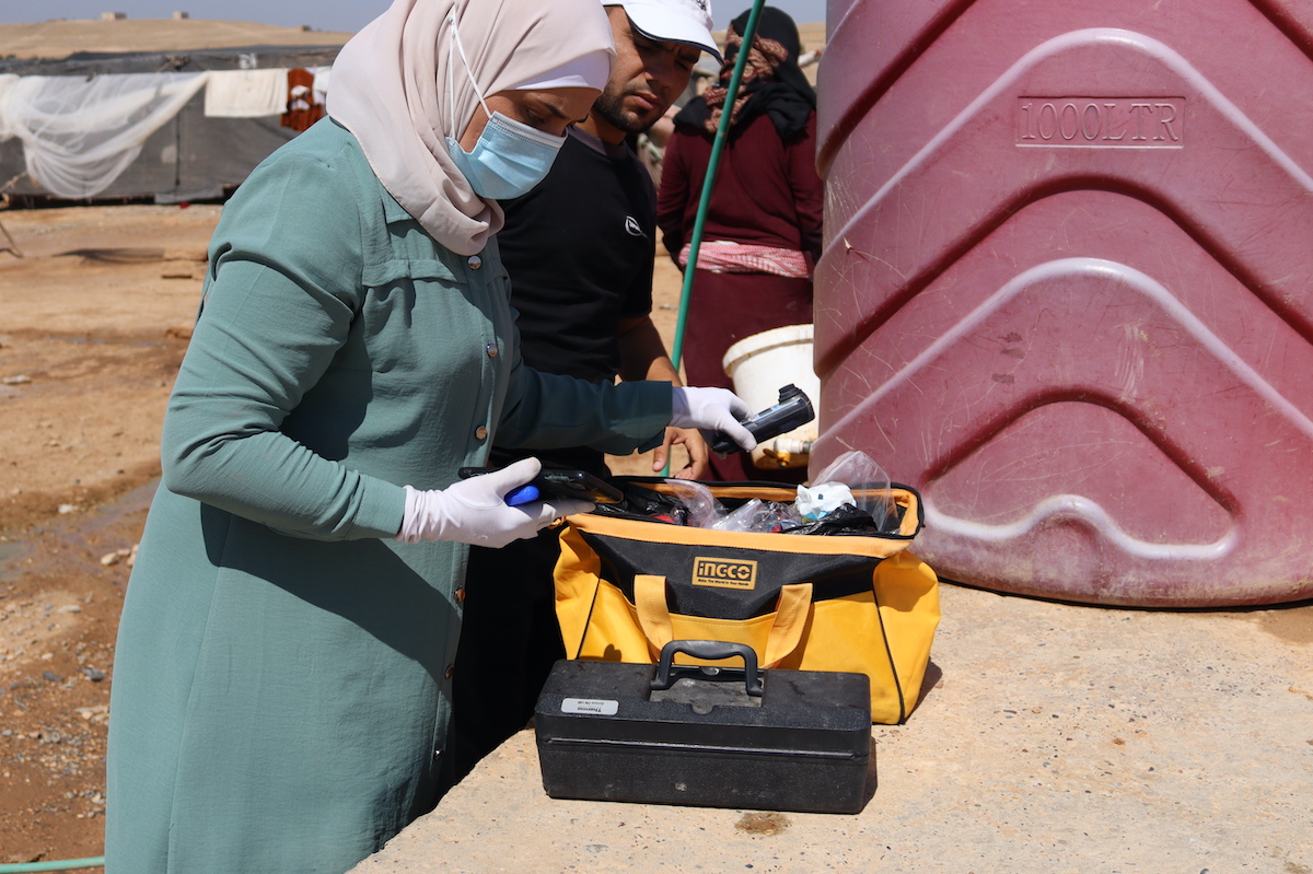 Water quality is tested in Twaihina Camp, Al-Tabqa in Syria. (Photo: Concern Worldwide)