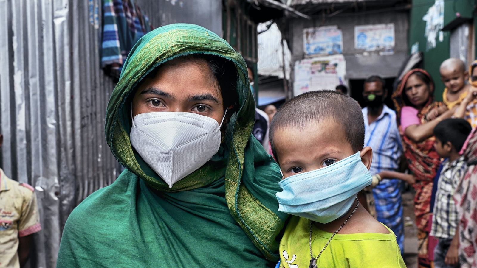 A woman and girl in Bangladesh wear face masks to prevent the transmission of COVID-19. 