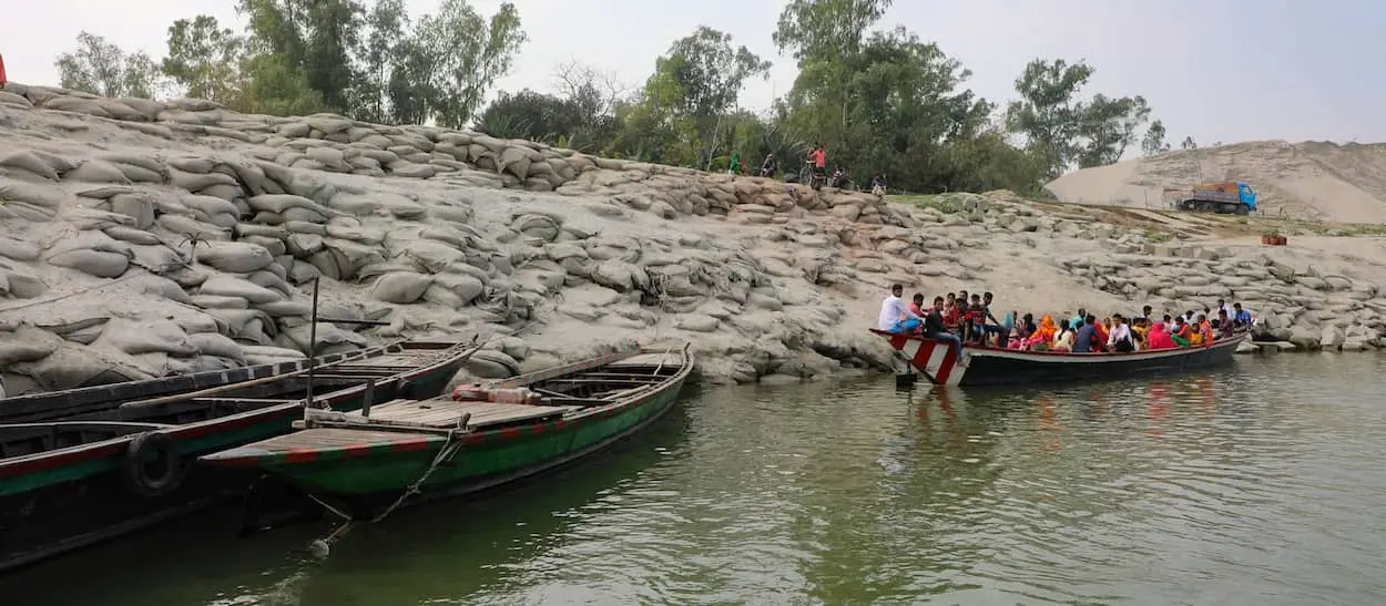 Sand bags line the embankments of one of the Char islands severely affected by recent floods.