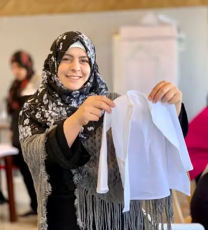 A Syrian refugee taking part in embroidery training.