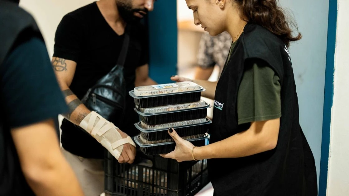 Humanitarian volunteer distributes food to families displaced in Lebanon