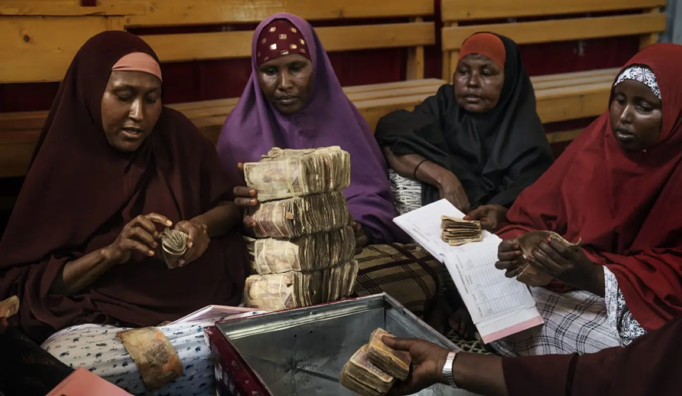 Group of women in Mogadishu counting money.