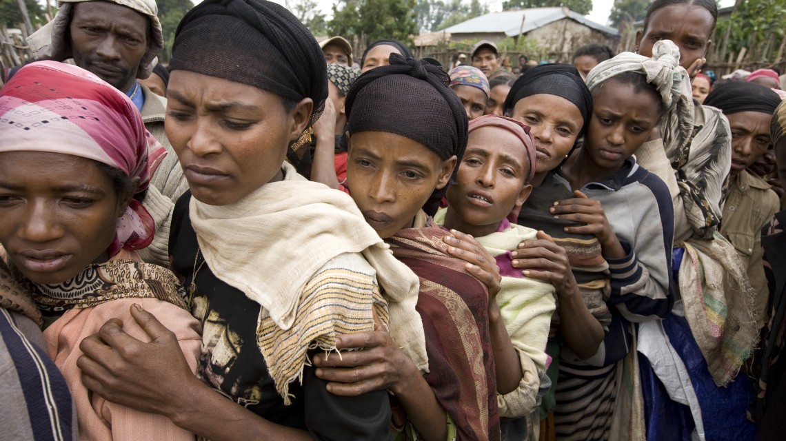 Drought-affected Ethiopians wait to be admitted to a distribution at a supplementary feeding center run by Concern Worldwide, 2008. (Photo: Mike Goldwater/Concern Worldwide)
