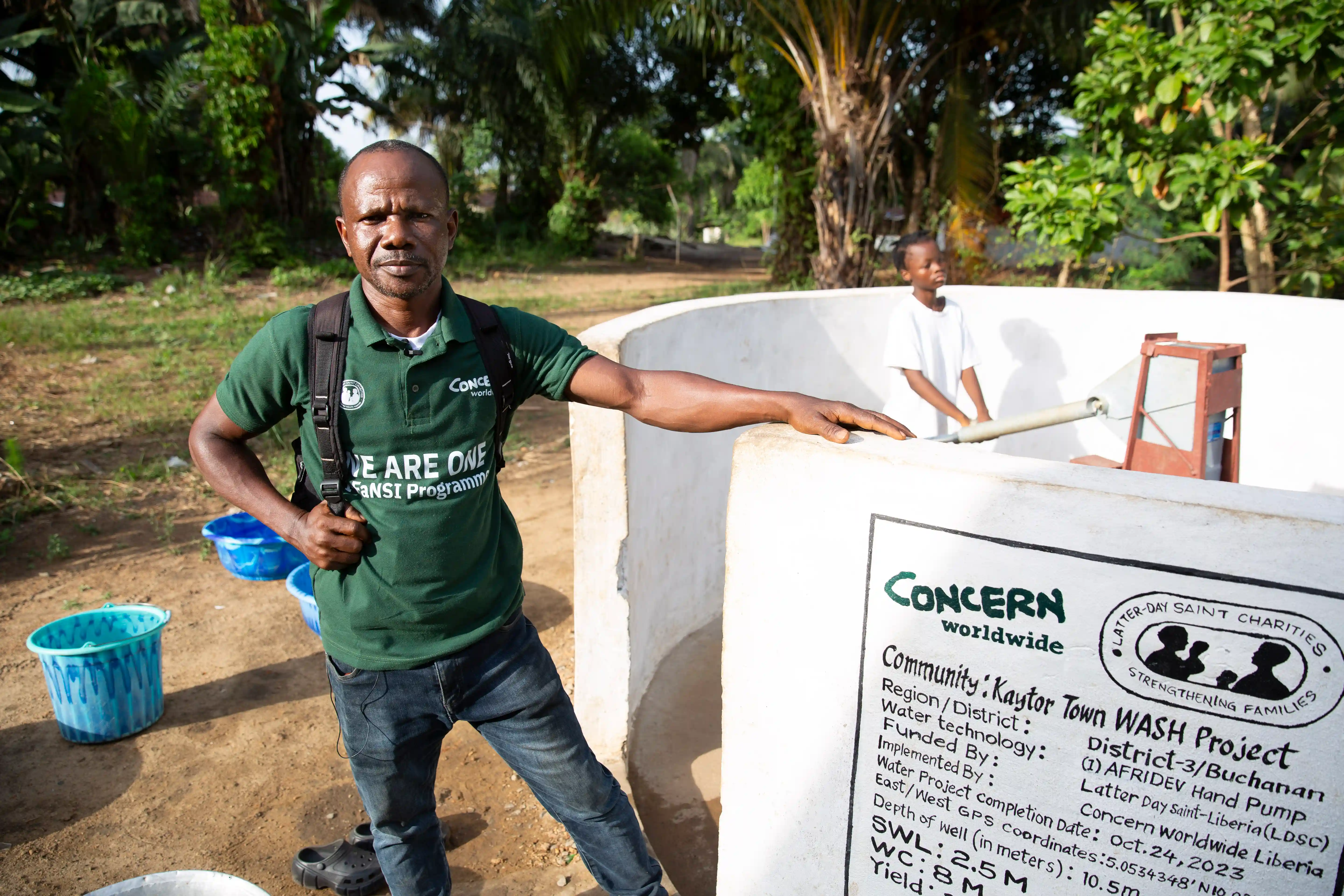 Concern's Site Supervisor, Albert D Morris at water point built by Concern in Kaytor Town, Liberia