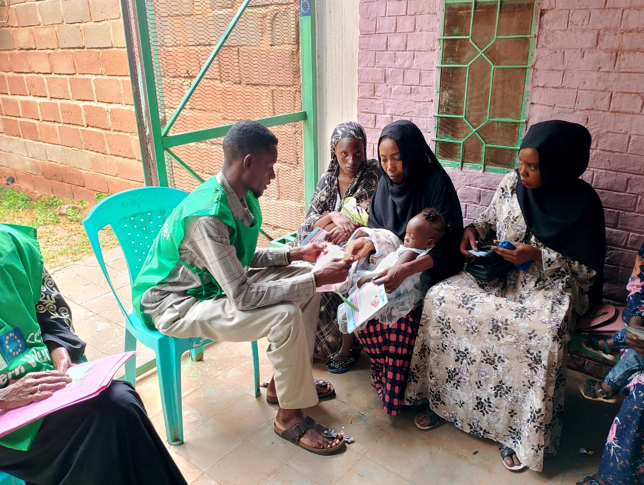 A Concern staff member working with mothers and infants.