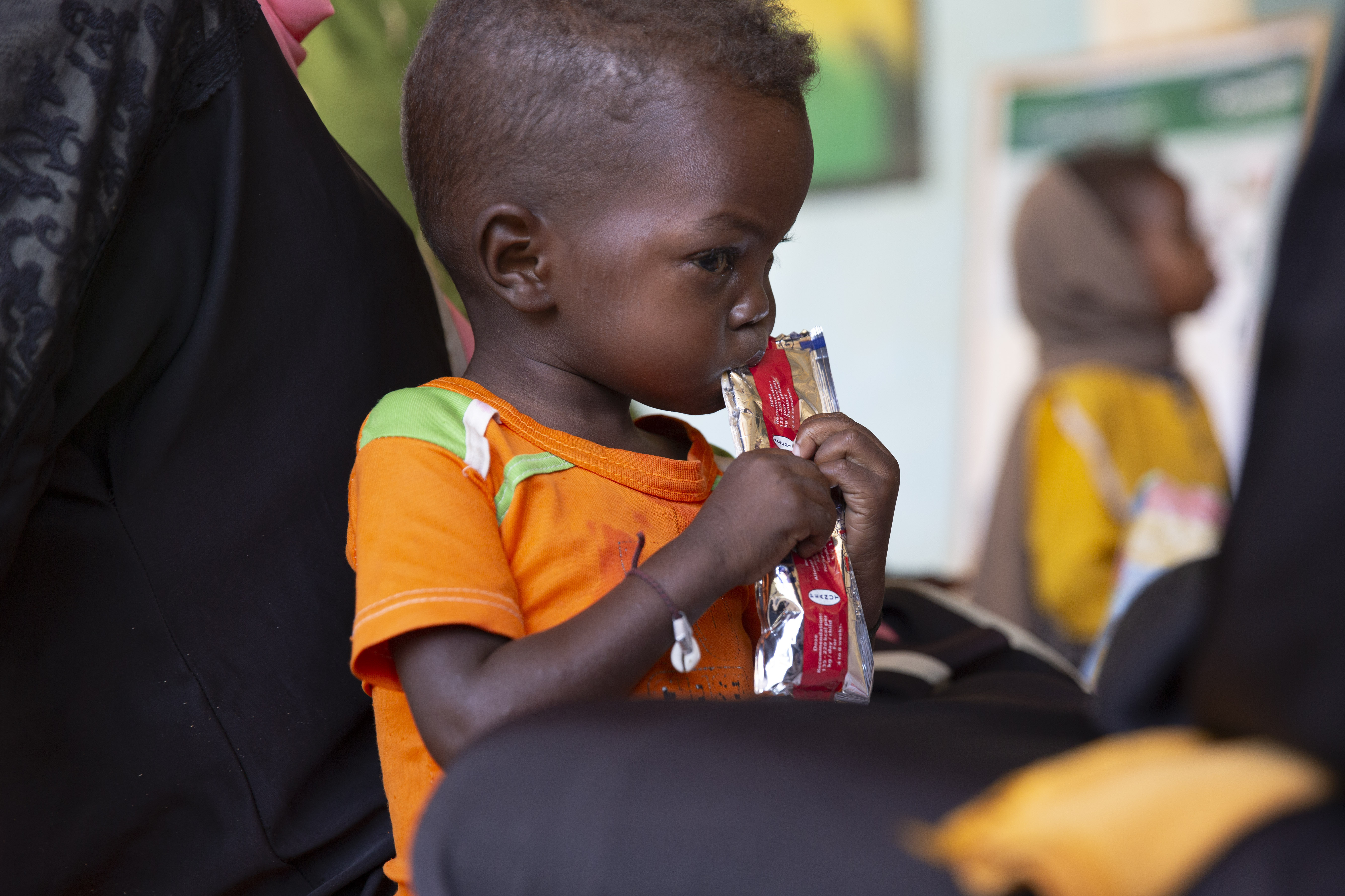 Jamal eats therapeutic food at a nutrition clinic, supported by Concern Worldwide, in Ardamata, just outside El Geneina, Sudan. Jamal* is severely acutely malnourished. Concern supported almost 480,000 people in Sudan during the first 10 months of this year. Photo: Kieran McConville/Concern Worldwide.
