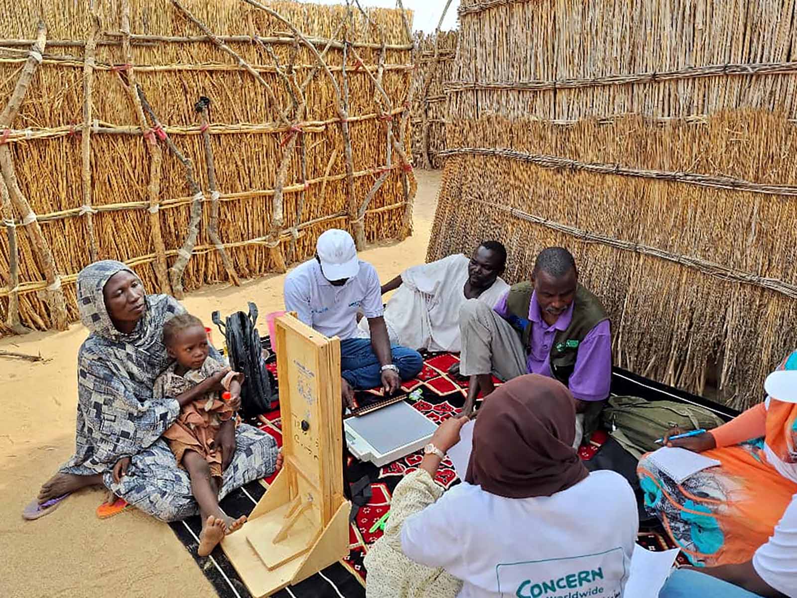 Concern staff training volunteers and participants in IDP camps in West Darfur, Sudan.